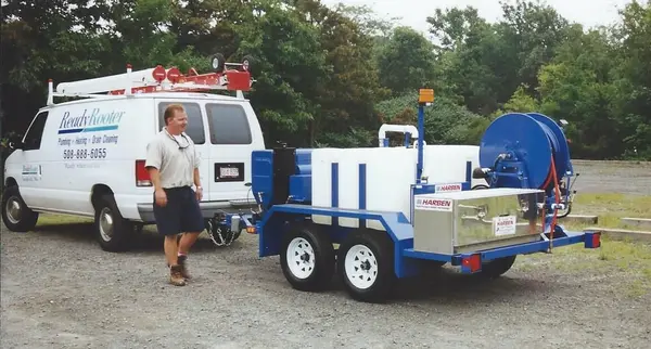 Ready Rooter technician with the trailer-mounted water jet