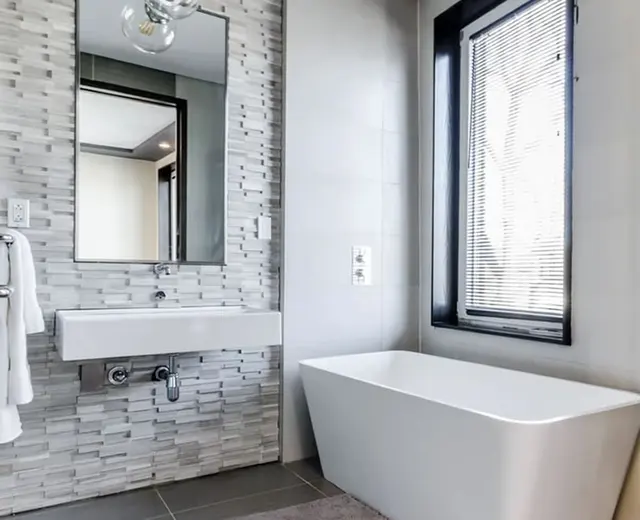 Finished bathroom with modern plumbing fixtures installed by Ready Rooter
