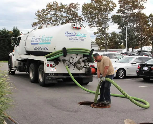 Ready Rooter technician pumping a septic tank