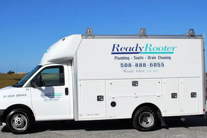 Ready Rooter service van beside a wooden bridge